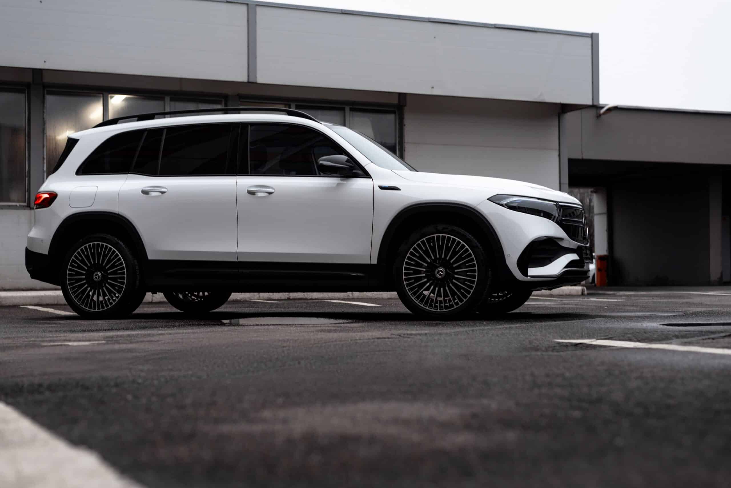 Modern white Mercedes-Benz EQB SUV parked outdoors showcasing luxury and style.